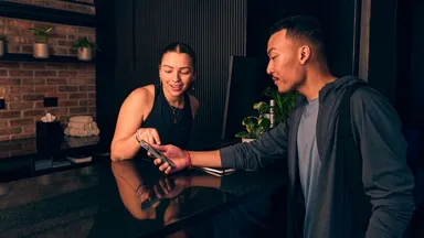 Two people at a fitness studio